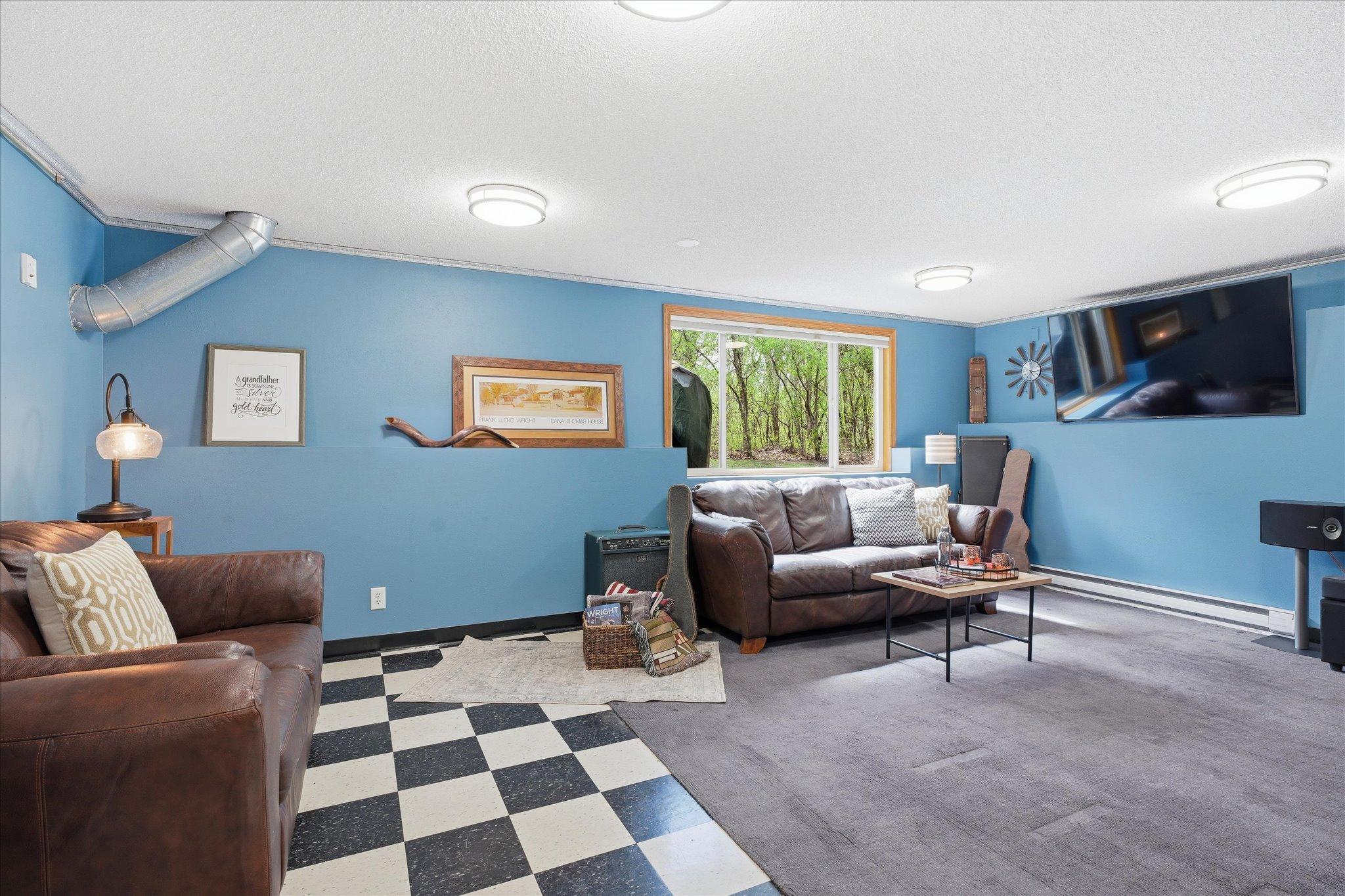 There is indeed a legal egress window, so this could literally be used as a great 5th bedroom. The TV mounting bracket is included as well.