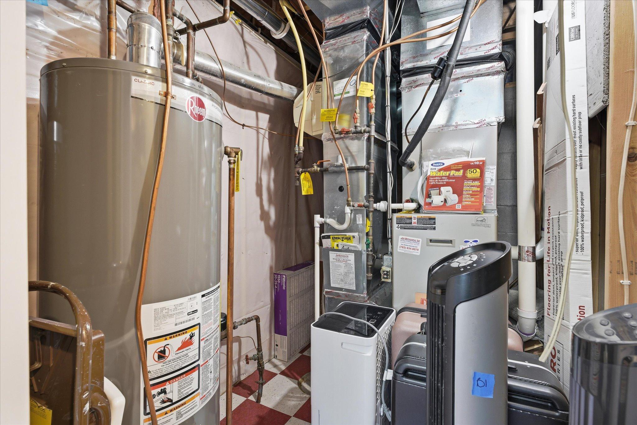 The water heater was new in 2016. The furnace and AC were new in 2012. The ducts were cleaned in 2022. There is extra flooring down here too, and you can have it. And don't miss the duct-mounted Aprilaire humidifier.