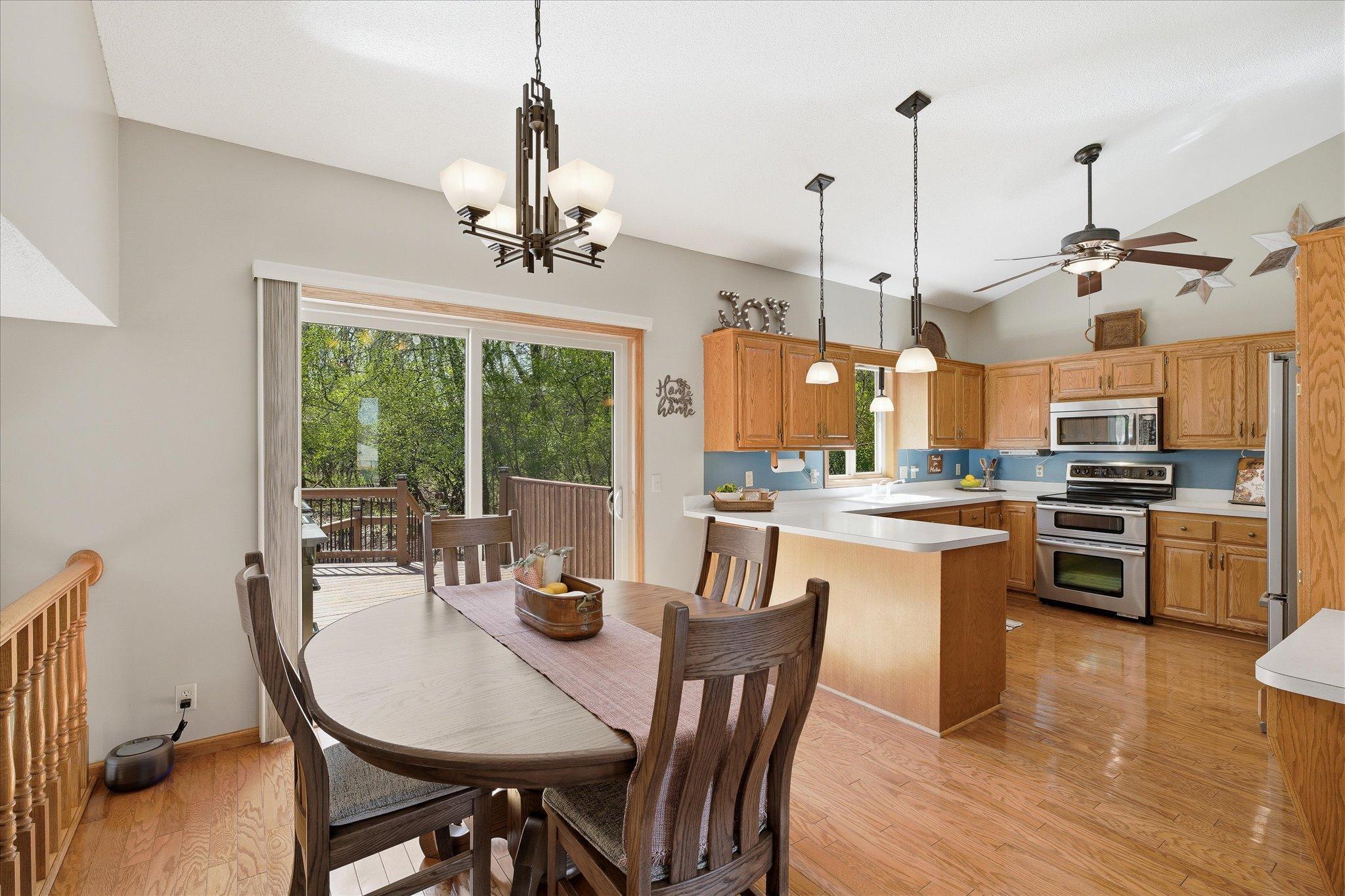 The informal dining space walks out to the deck through a one-year-young patio door, and connects directly to the large & beautiful kitchen.