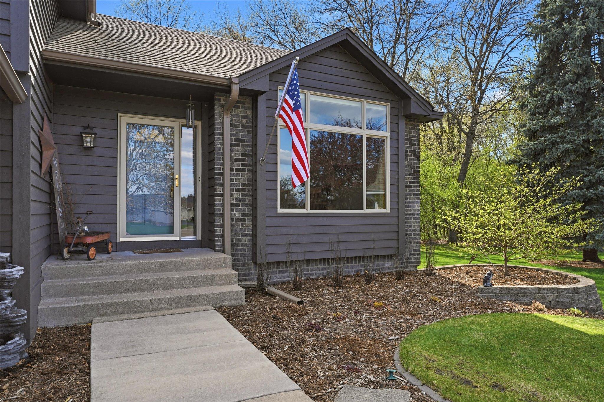 The full ligh storm door and enormous front window flood the space with natural light.