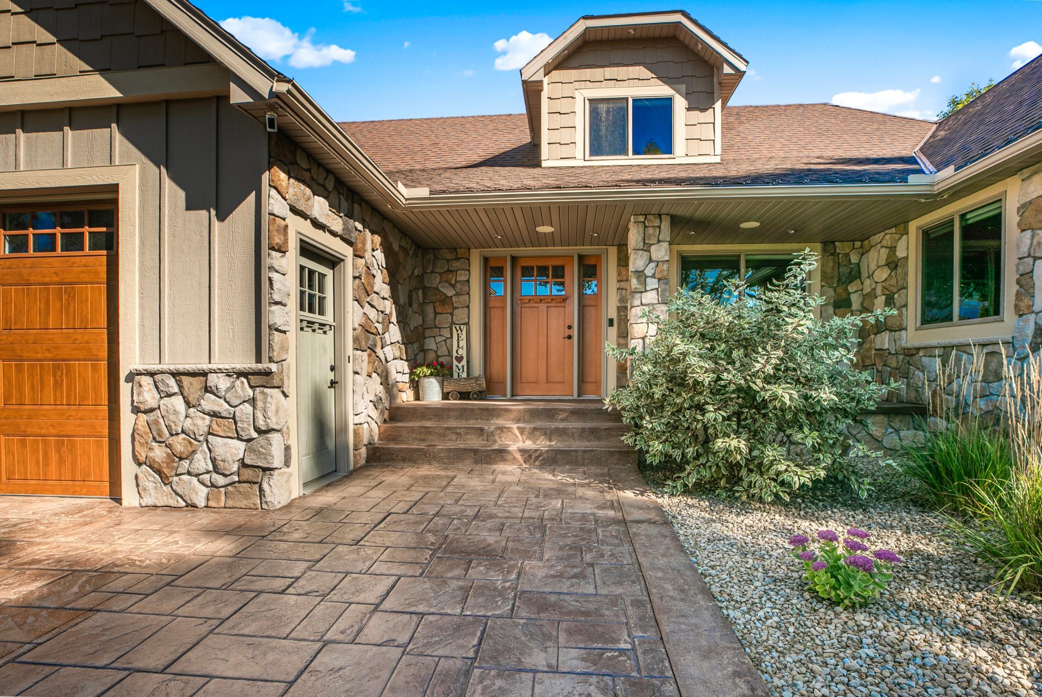 Seamless rain gutters and both recessed and color-changing soffit lighting add to the year-round appeal.