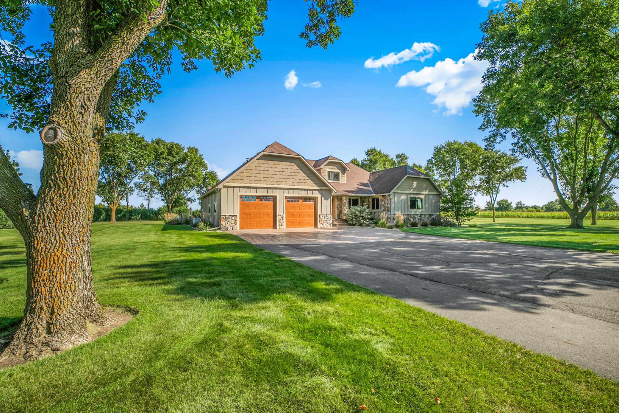 Situtated on 3.63 beautifully landscaped acres near trails, golf course, and the chain of lakes, this thoughtfully designed property blends luxury living with exceptional functionality.