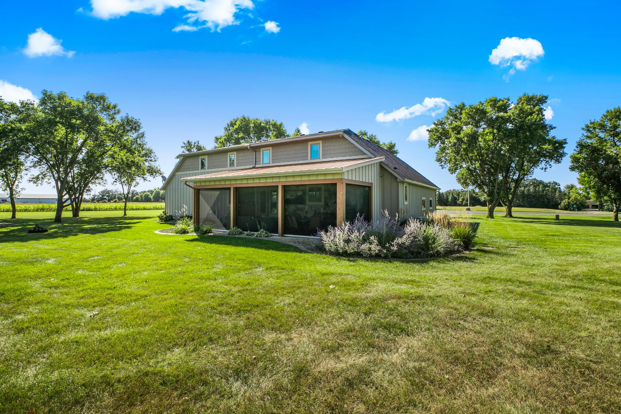 The screened porch features motorized retractable screens.