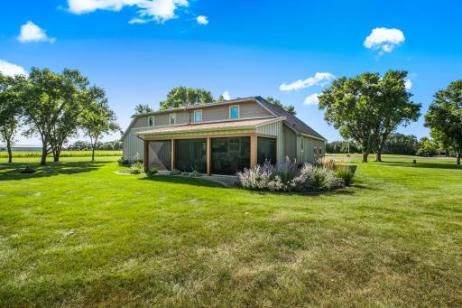 The screened porch features motorized retractable screens.