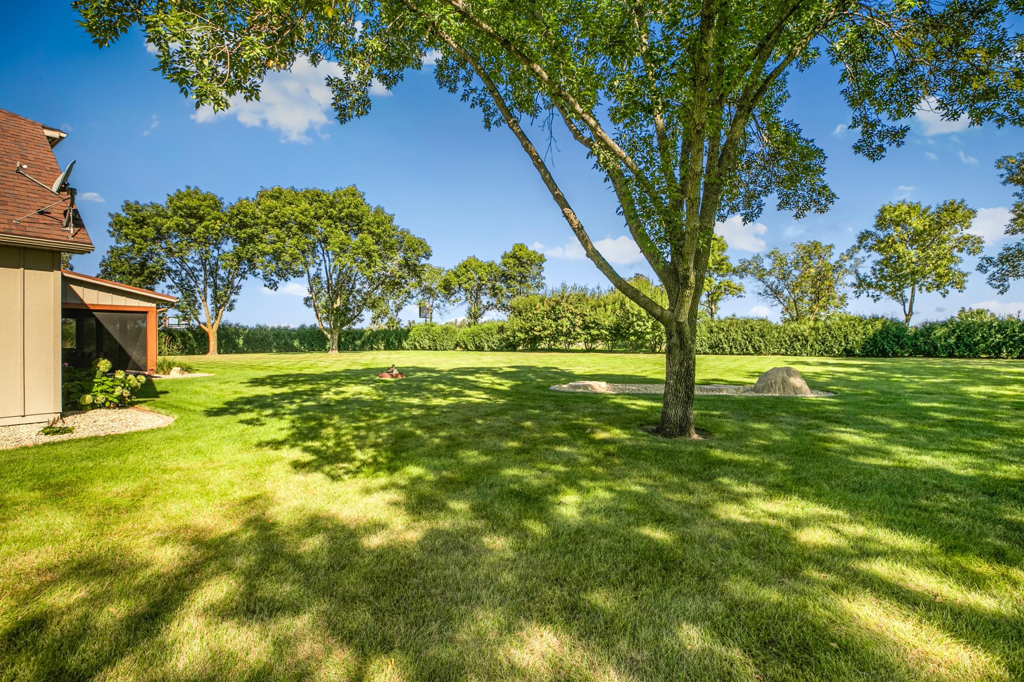 Mature trees allow for relaxing in the shade while the kiddos play outdoors.