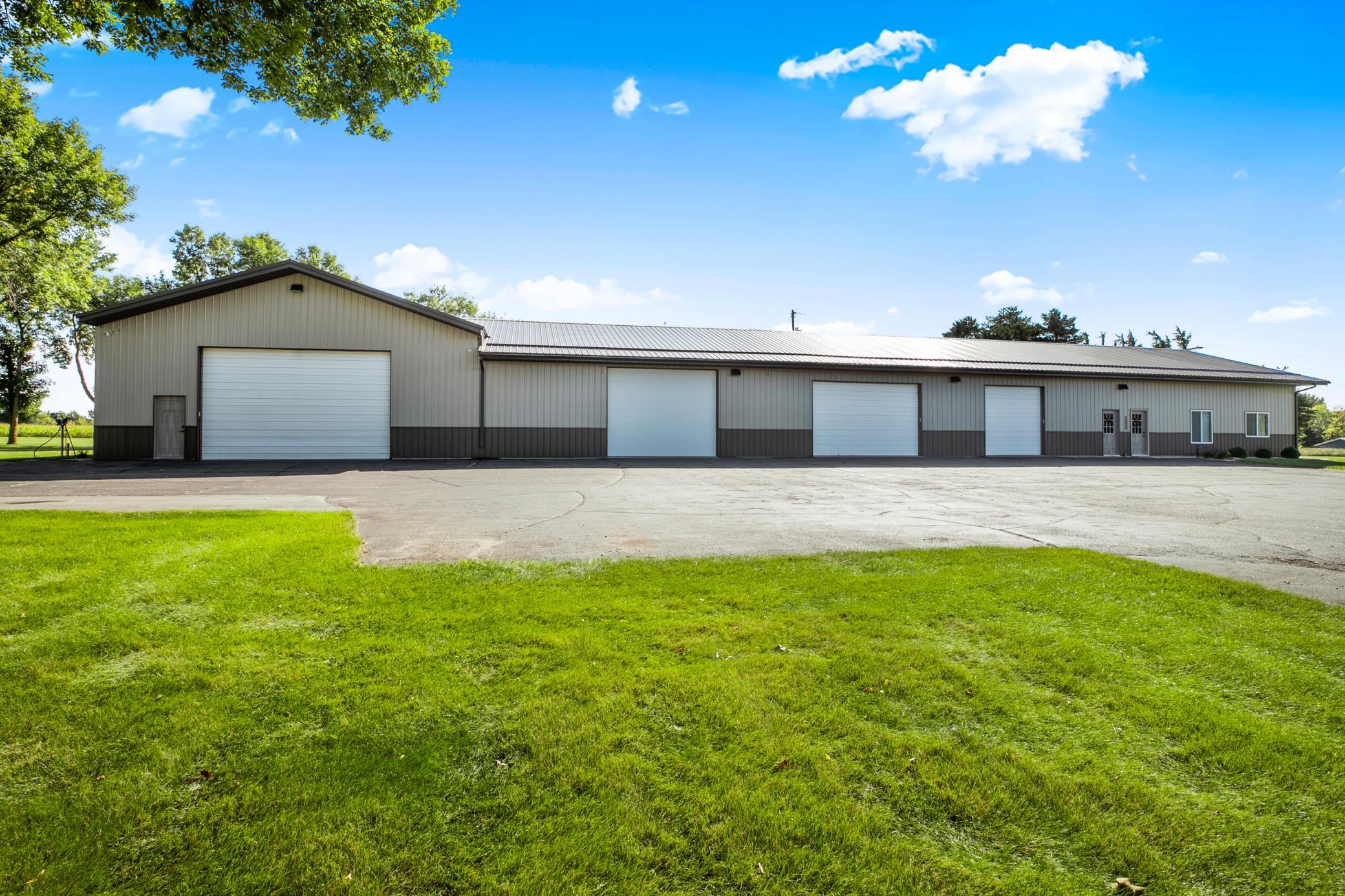 The outbuilding adds unmatched versatility, offering over 3,400 sq ft of heated space and 8,000+ sq ft of additional cold storage. Of the 3,400 heated space, 1,320 sq feet is office space and the remaining 2,080 sq feet is heated work shop space.