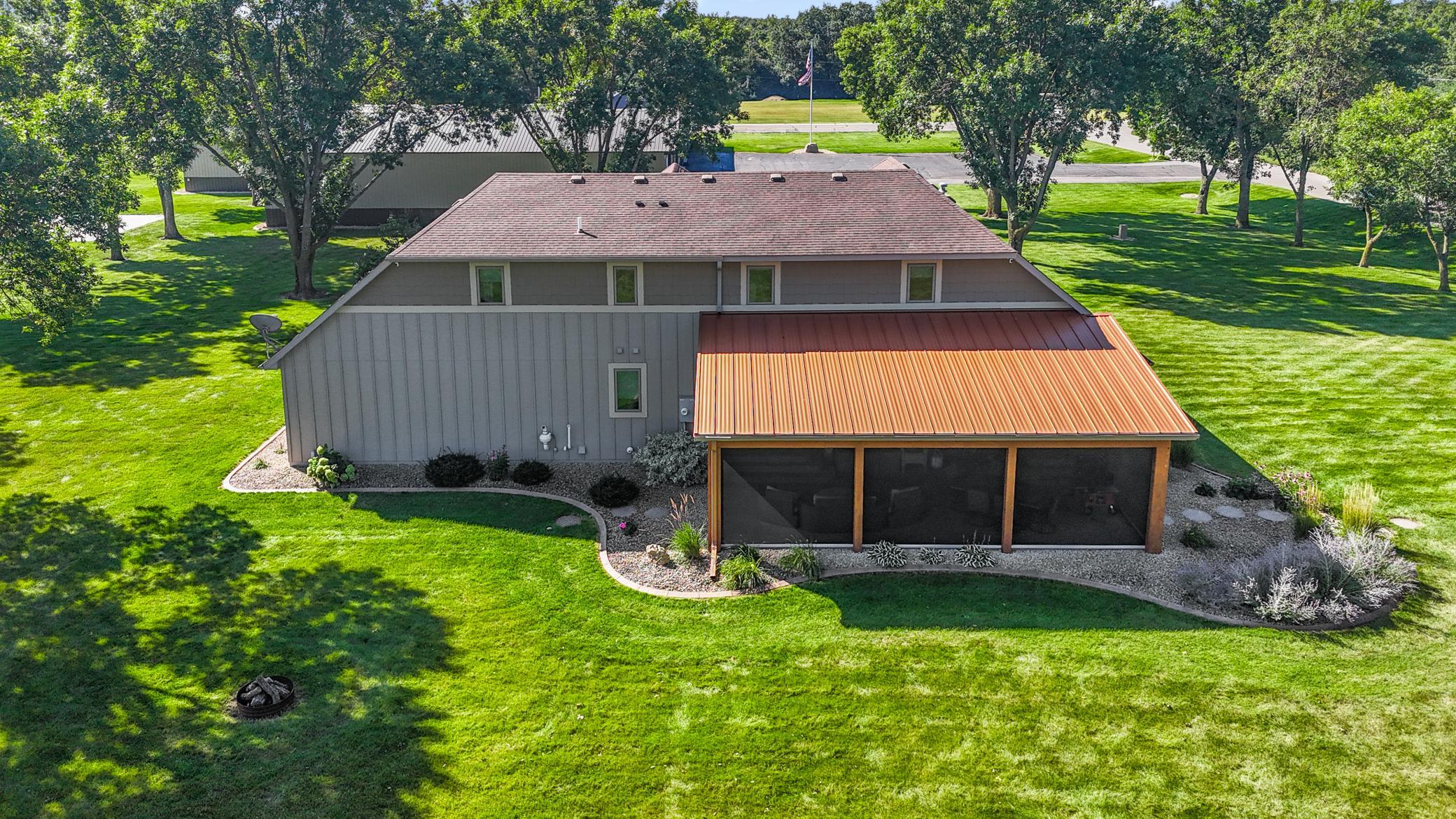 The screened porch also features built-in speakers, and ceiling fans.