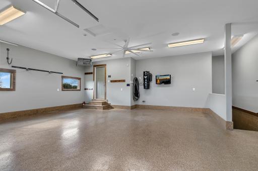 The attached garage was just recently painted and both overhead garage doors have side mounted LiftMaster overhead garage doors. Garage doors, garage heater, and garage epoxy floor new in 2016.