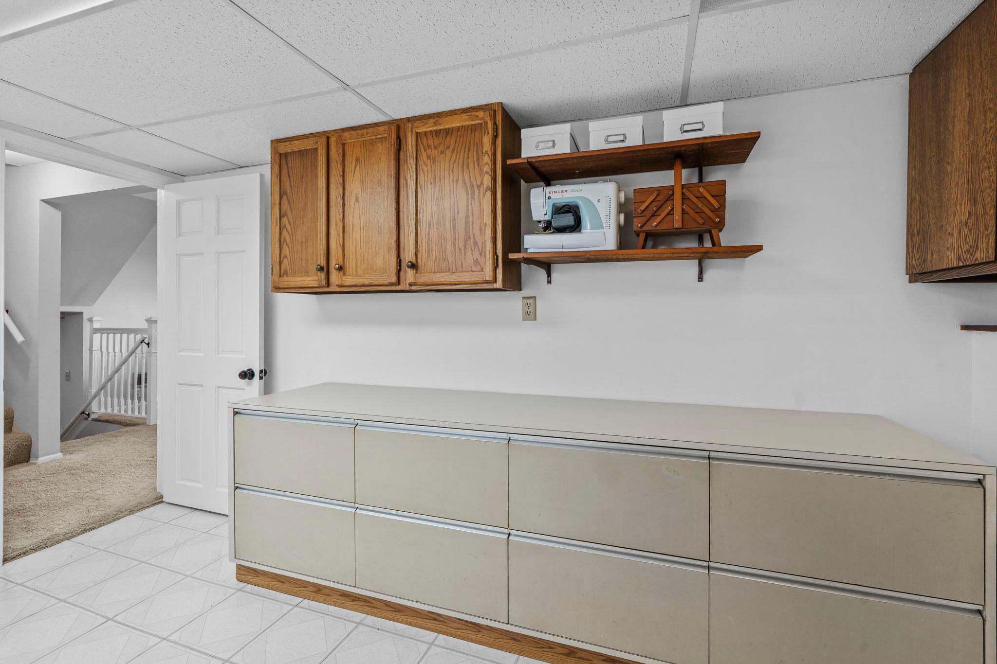 Finished laundry room with abundance of storage!