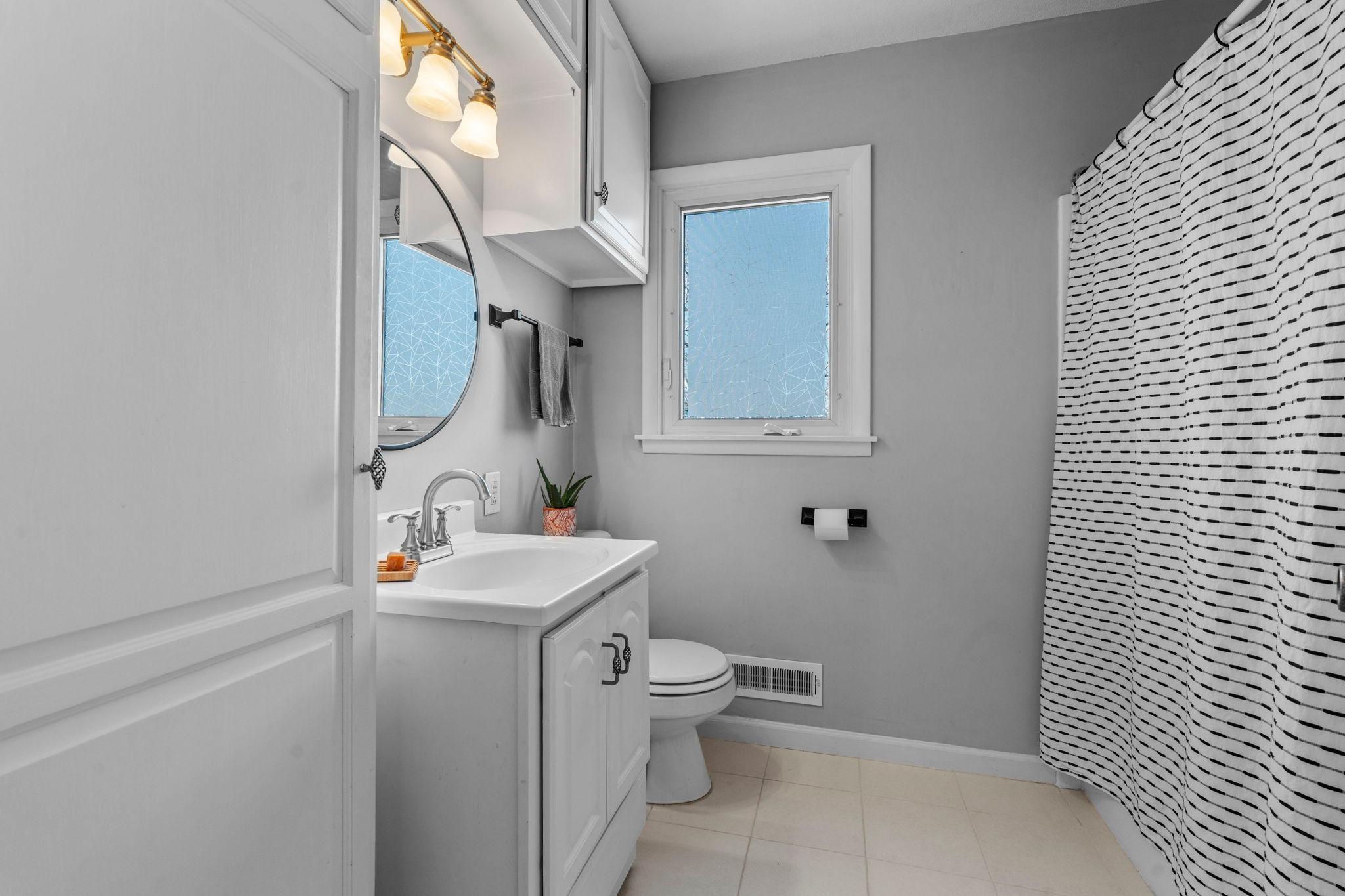 Upper level bathroom with extra linen storage.
