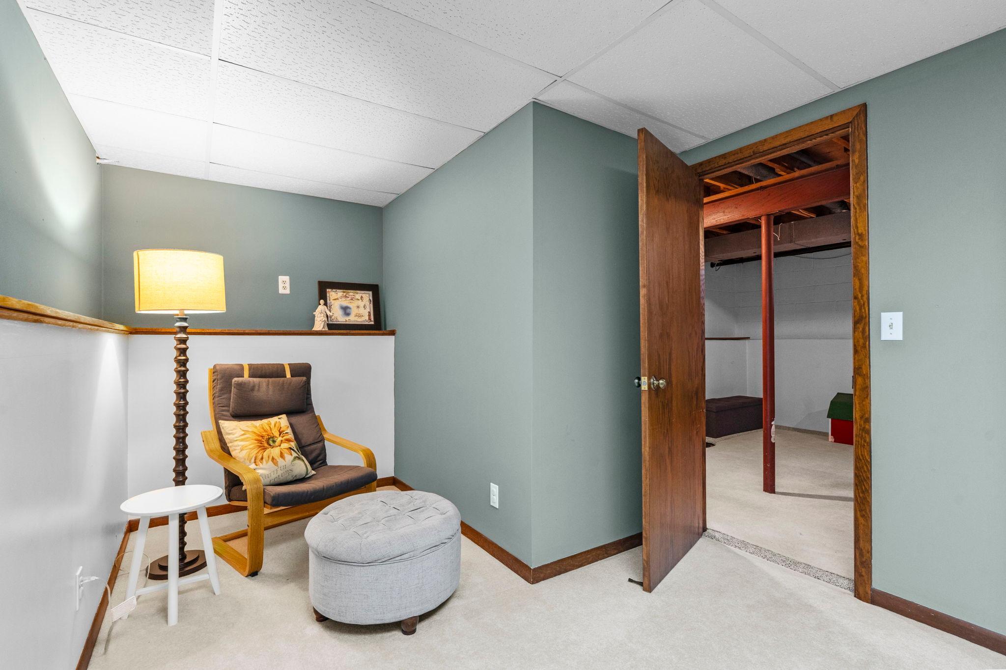 Finished lower-level office/den offers a private space set up for working from home, a study area, or a cozy retreat. Versatile flex room easily adapts to your needs—home office, guest space, hobby room, etc.