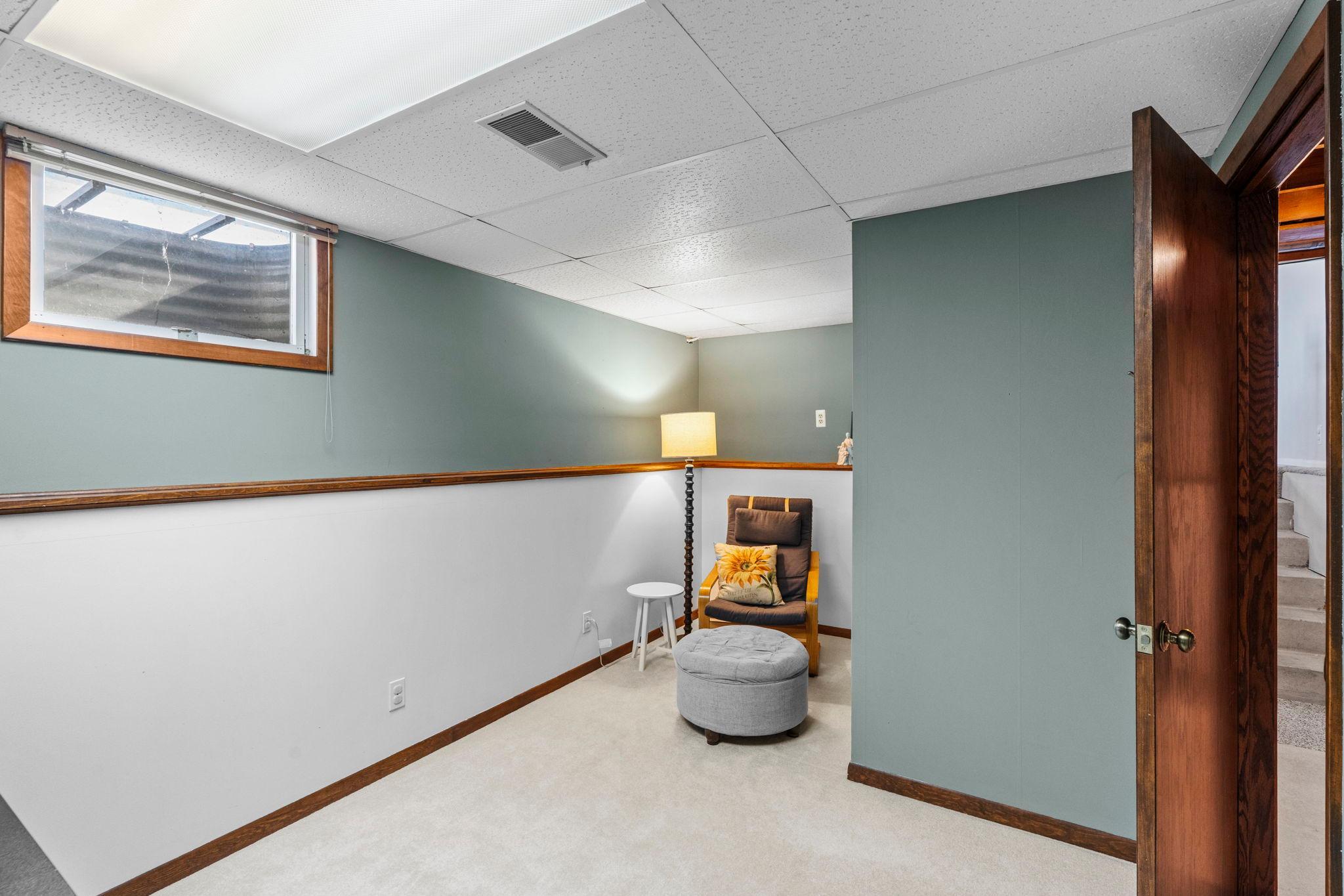 Finished lower-level office/den offers a private space set up for working from home, a study area, or a cozy retreat. Versatile flex room easily adapts to your needs—home office, guest space, hobby room, etc.