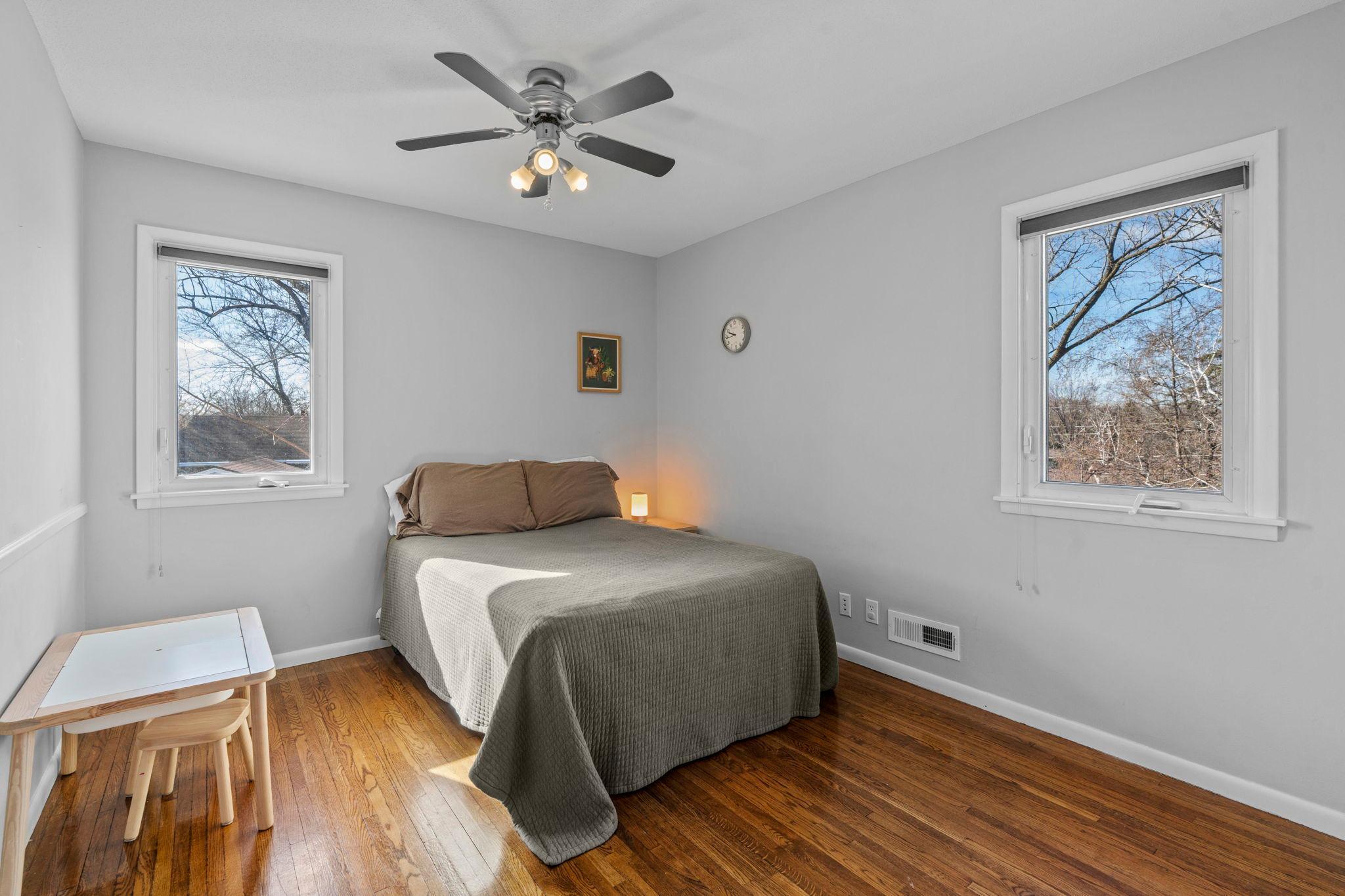 Double windows and beautiful hardwood flooring.