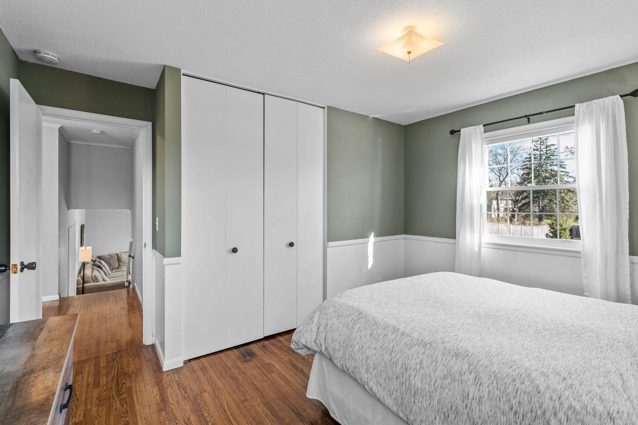Stylish wainscoating and white closet doors!