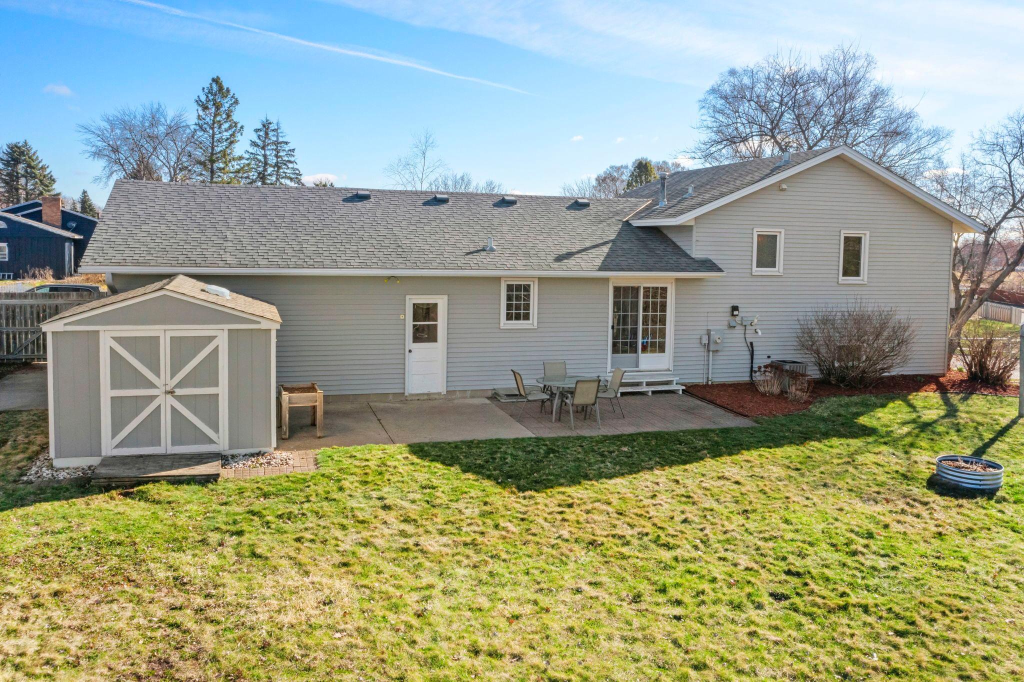 Huge backyard patio and storage shed for all the extras!