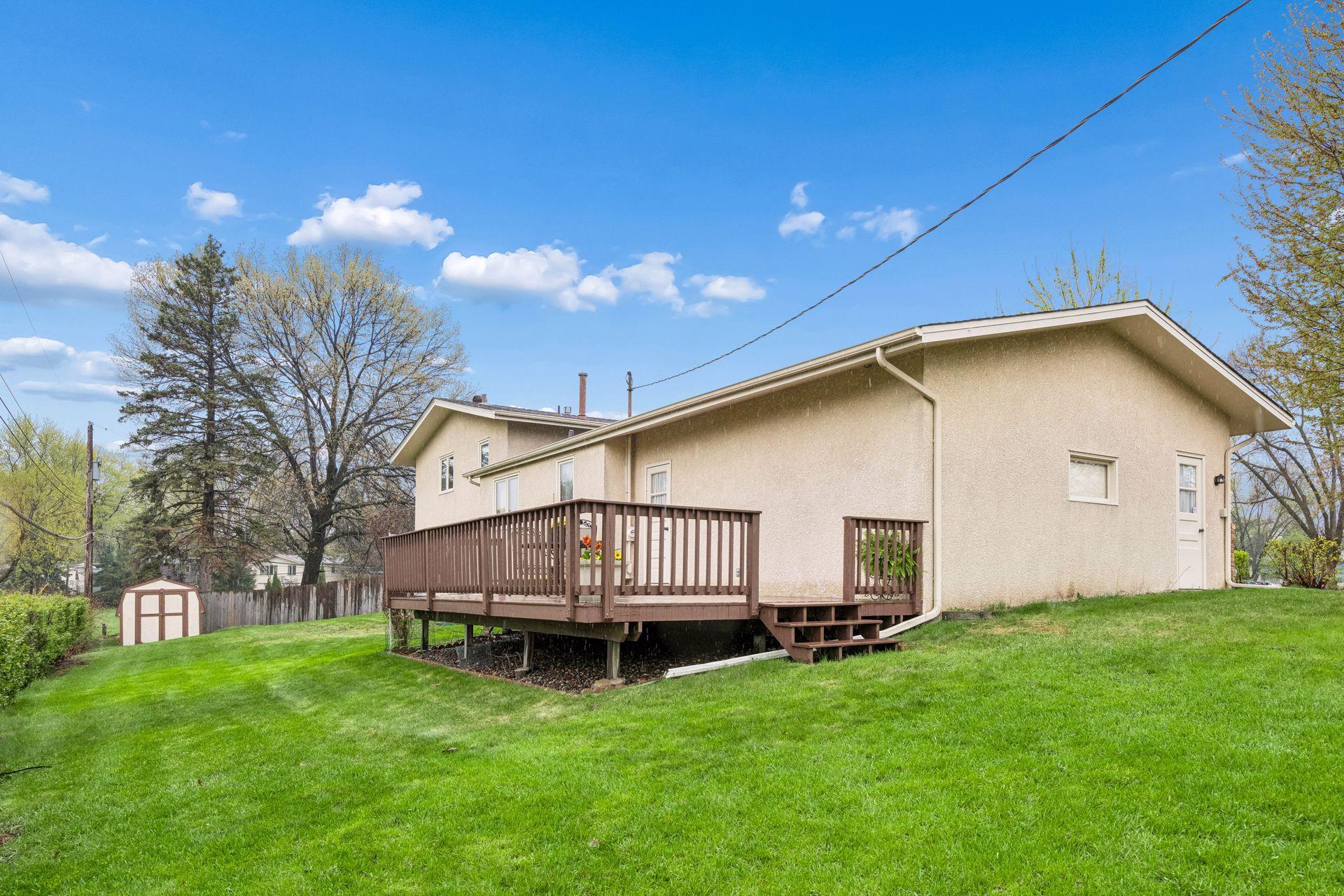Rear walkout with huge deck overlooking Sunny Acres Park!