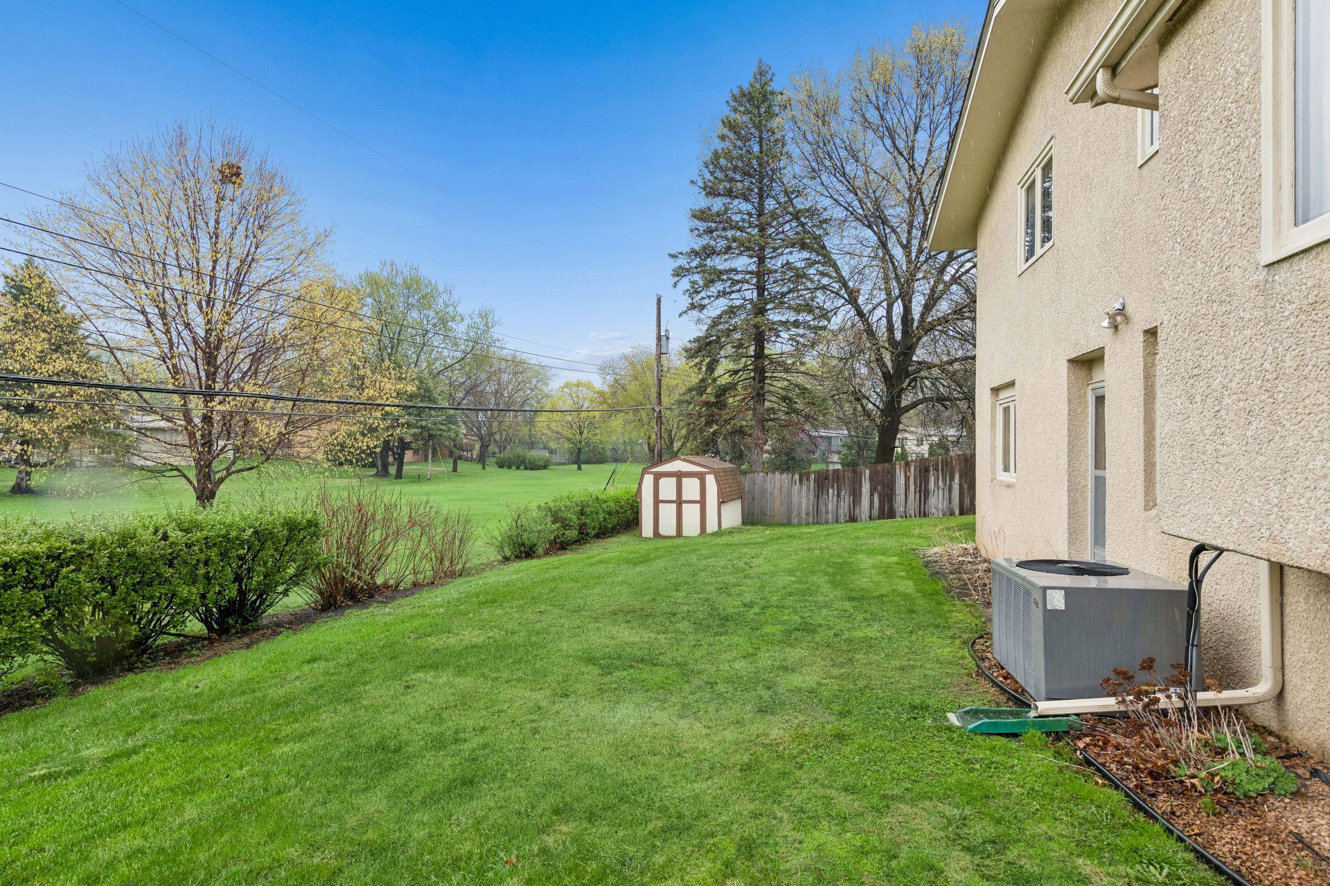Walkout lower level with 8x12 storage shed.