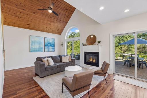 Open concept main level with gas fireplace.