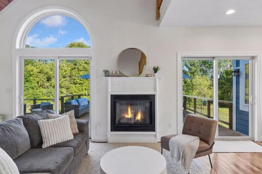 Open concept main level with gas fireplace.