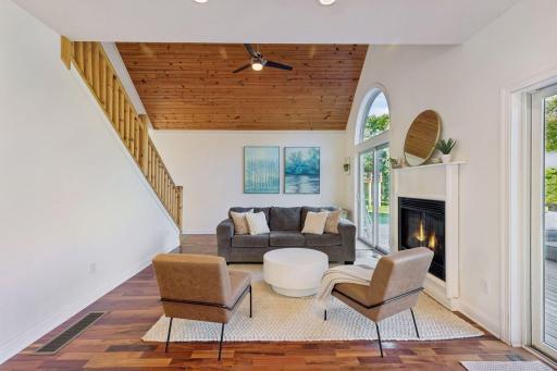 Open concept main level with gas fireplace.