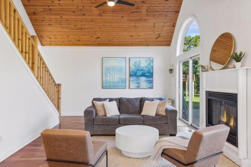 Open concept main level with gas fireplace.