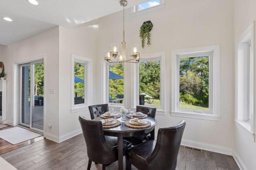 Dining nook has extra windows and overlooks backyard.