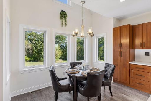 Dining nook has extra windows and overlooks backyard.