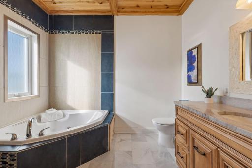 Owner’s suite with jetted tub and shower.