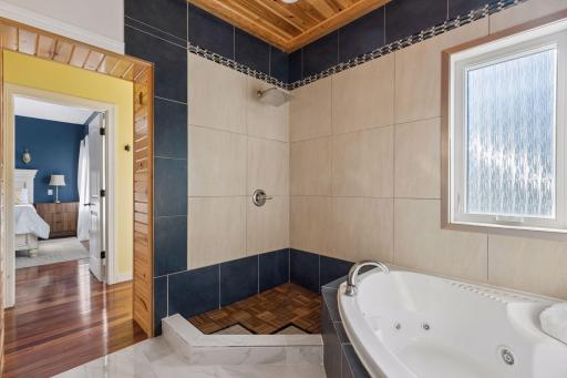 Owner’s suite with jetted tub and shower.