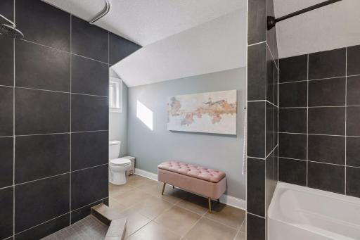 Upper level full bathroom, complete with both a separate shower and a tub.