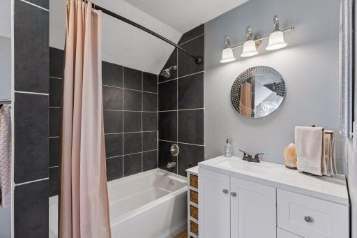 Upper level full bathroom, complete with both a separate shower and a tub.