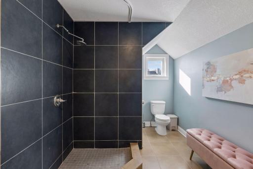 Upper level full bathroom, complete with both a separate shower and a tub.