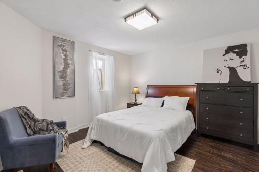 Lower level bedroom with egress window and closet.