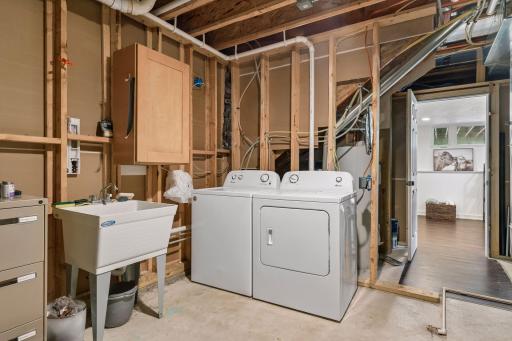 Spacious laundry room with storage space.