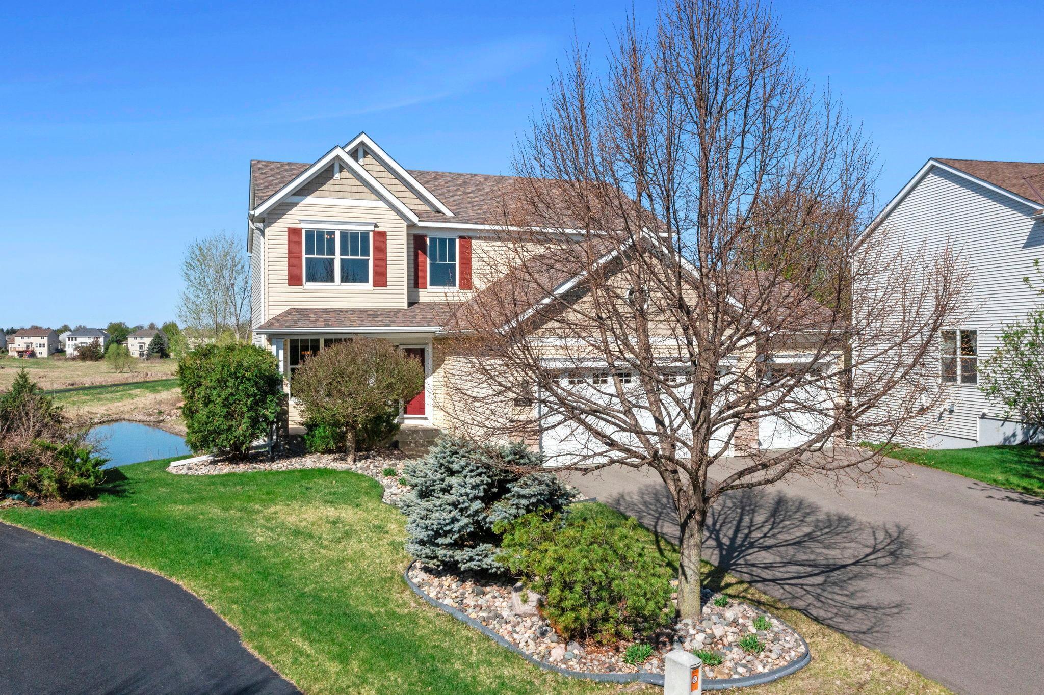 Beautiful landscape with new asphalt driveway