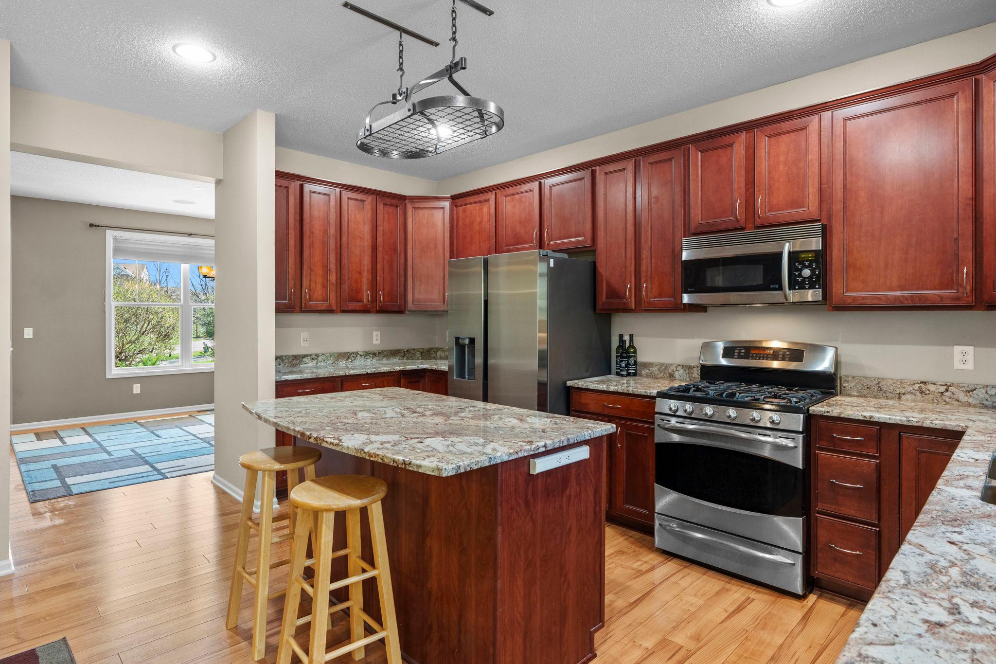 Large kitchen with granite counters and SS appliances