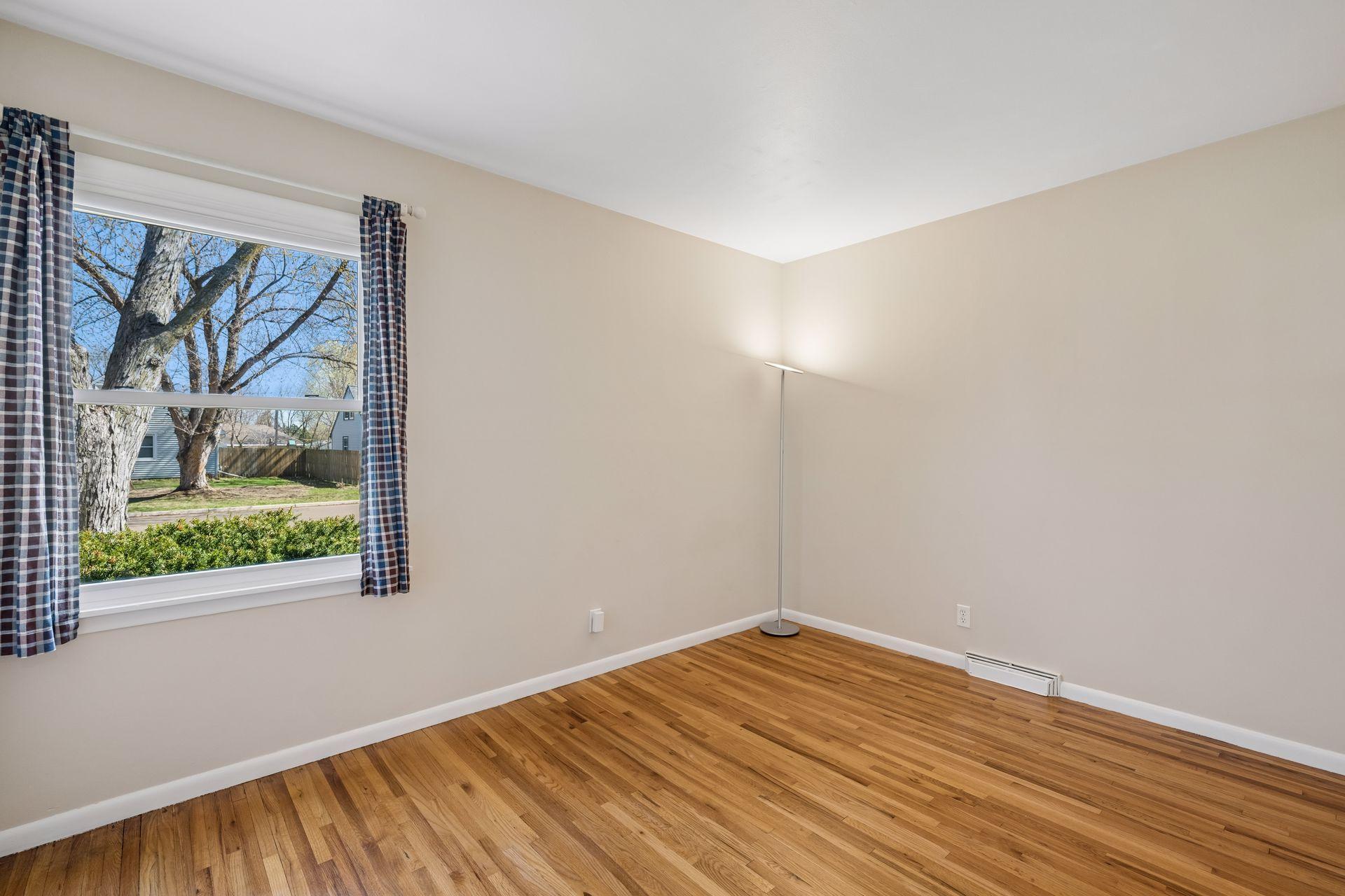 Bedroom one with windows overlooking side yard!