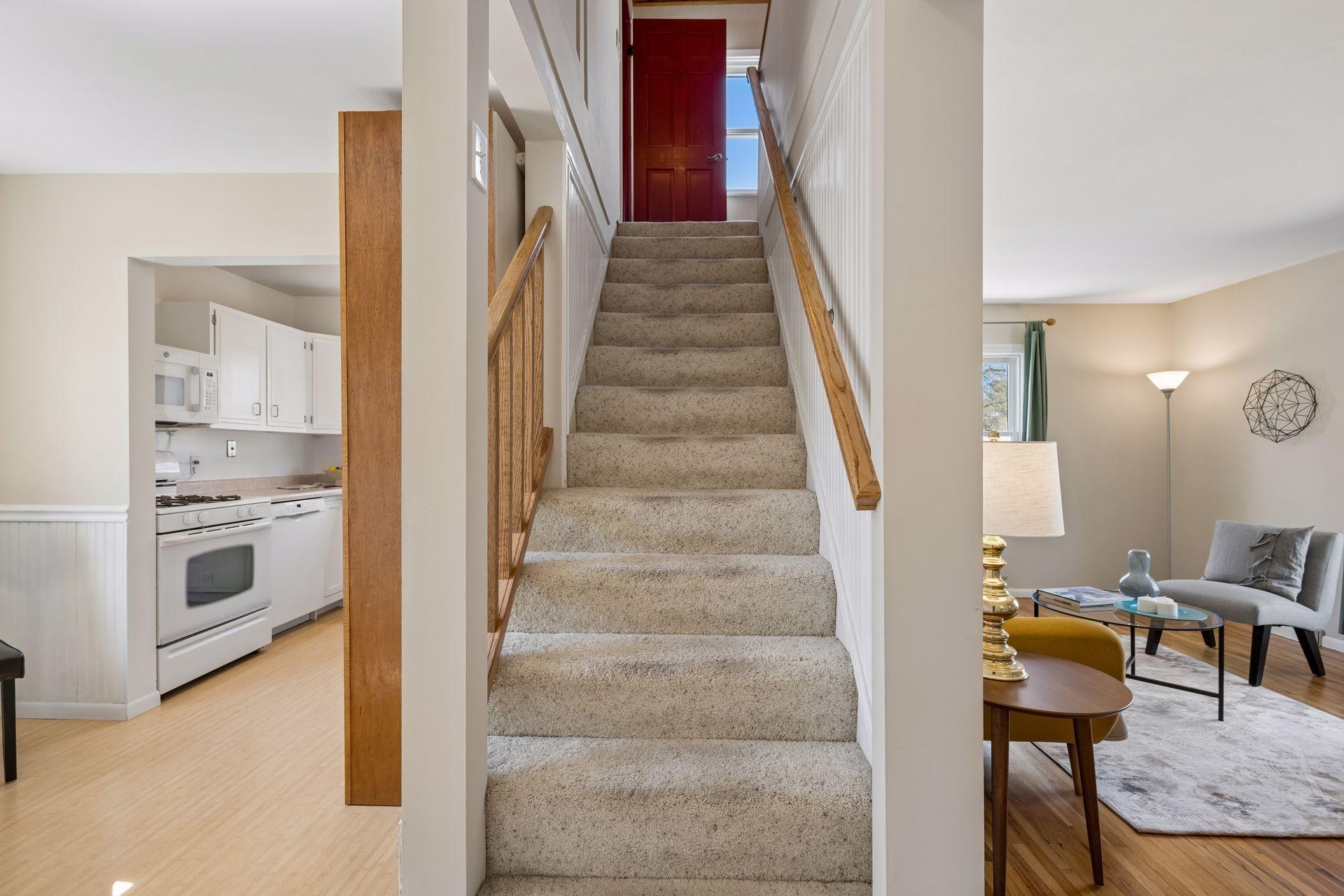 Open stair to the two upper rooms and the second bath.