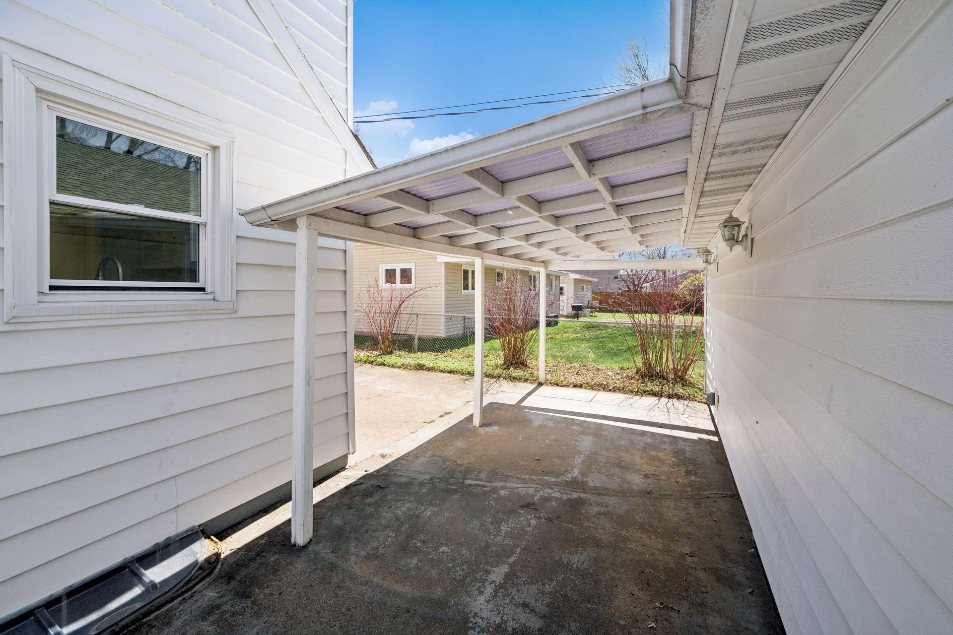 The covered patio area between house and garage is perfect for those rainy afternoons!
