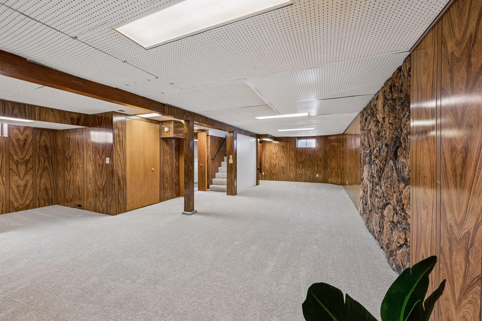 The 1960's is back and waiting for you to celebrate the abundance of space afforded by this large family / recreation room!