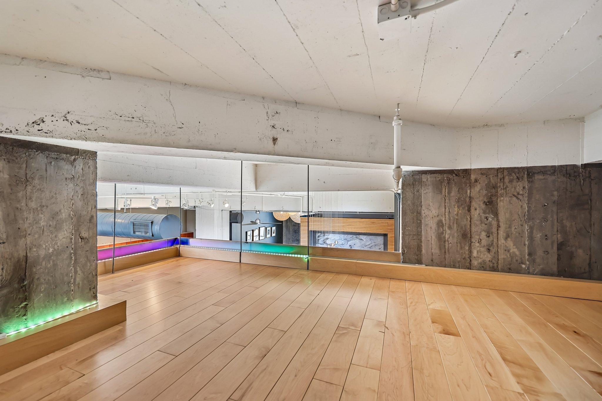 Loft area sits above office space, perfect for reading area or additional storage.