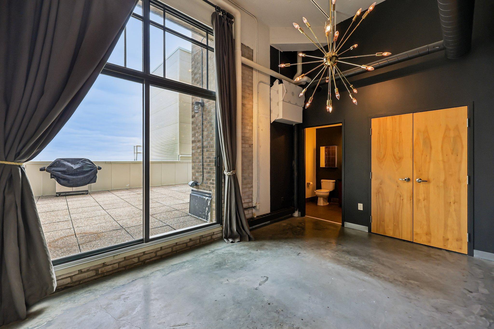 Primary bedroom features master ensuite bath with granite tile and walk-in shower. Generous closet space and stunning views overlooking South Minneapolis.