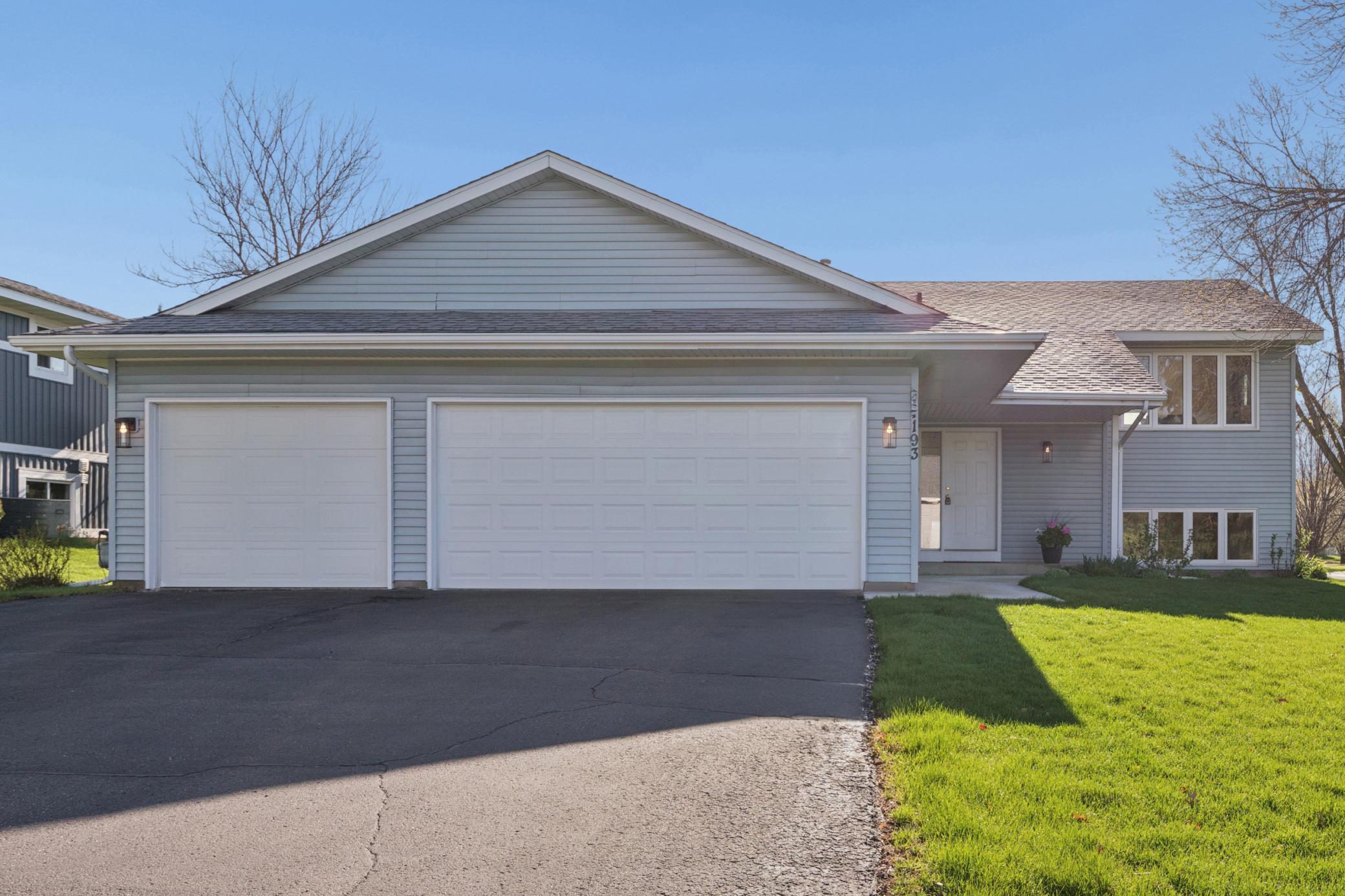 Classic curb appeal: charming exterior situated on an expansive corner lot in a highly desirable Shakopee neighborhood.