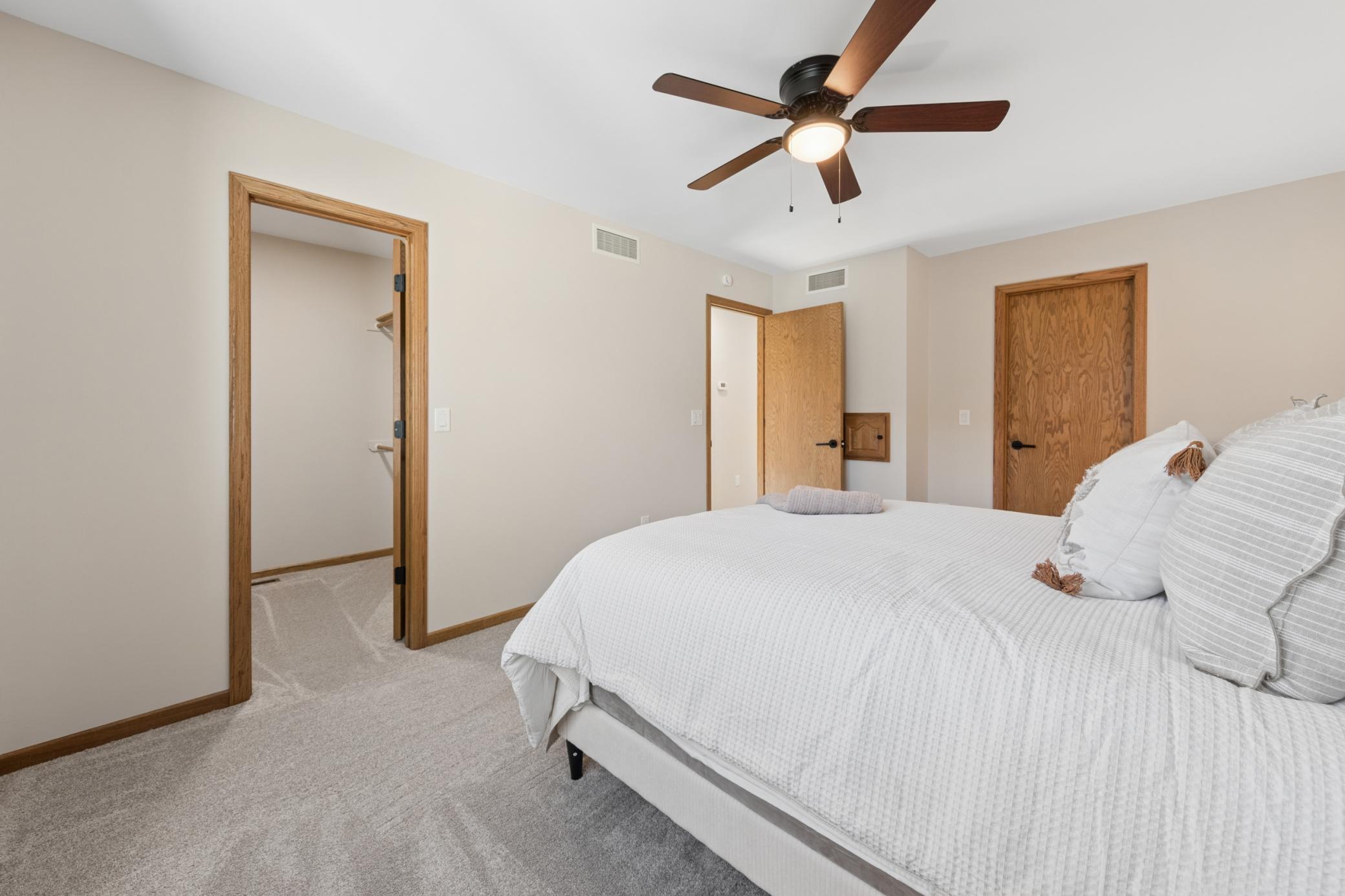 Primary bedroom features a private walk-in closet and convenient direct access to the bathroom.
