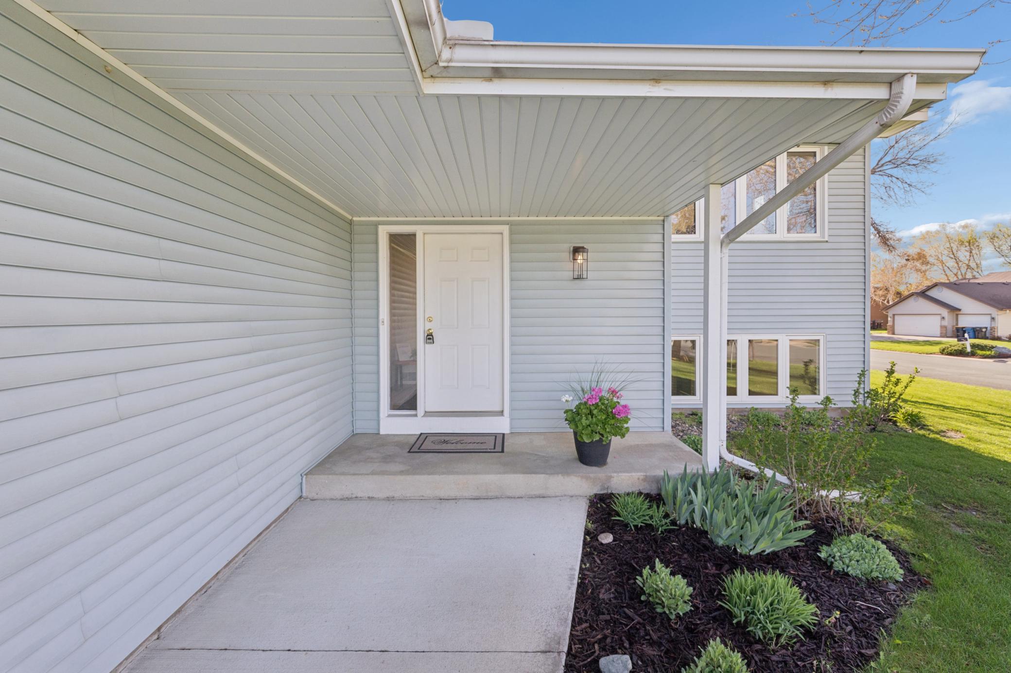 Welcoming and well-maintained front entrance, setting the perfect first impression for this charming Shakopee home.