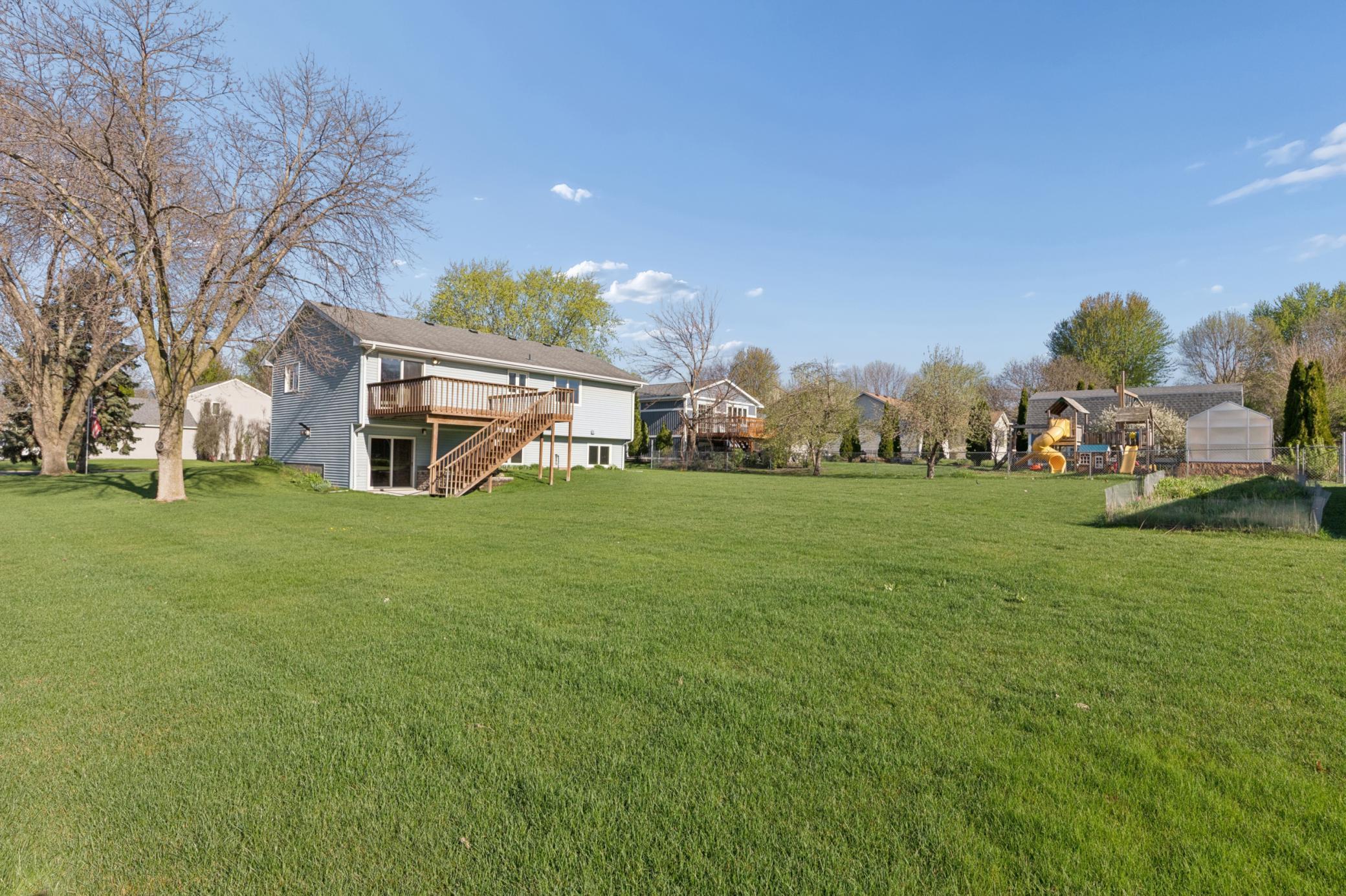 Expansive outdoor living space overlooking the generous corner lot.