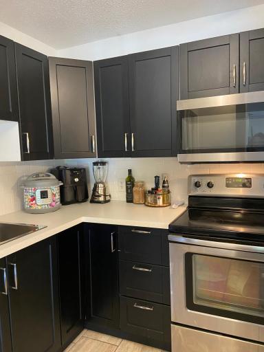 Look at this lovely kitchen with updated cabinets and stainless appliances