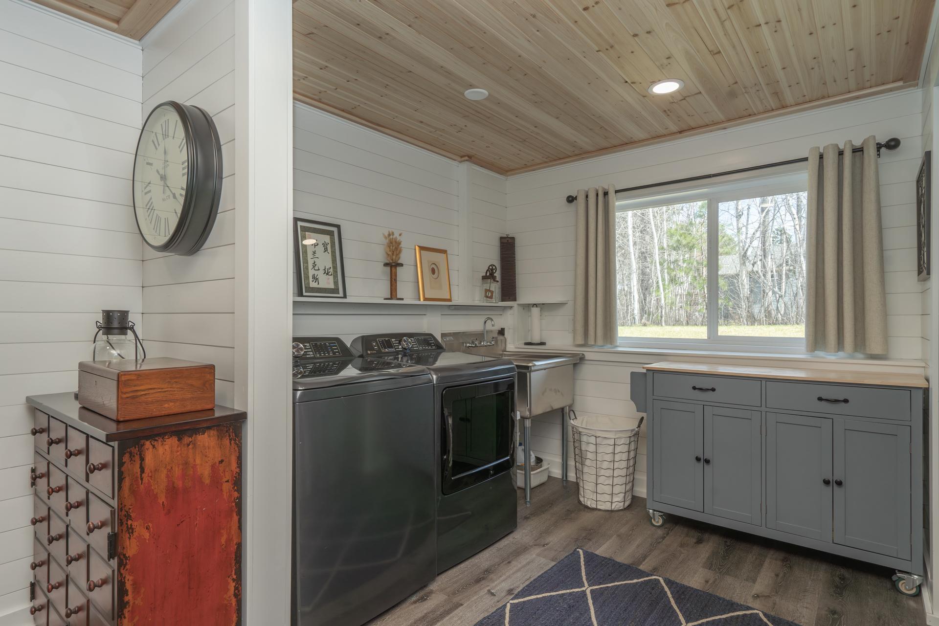 Lower-level space with a convenient laundry setup.