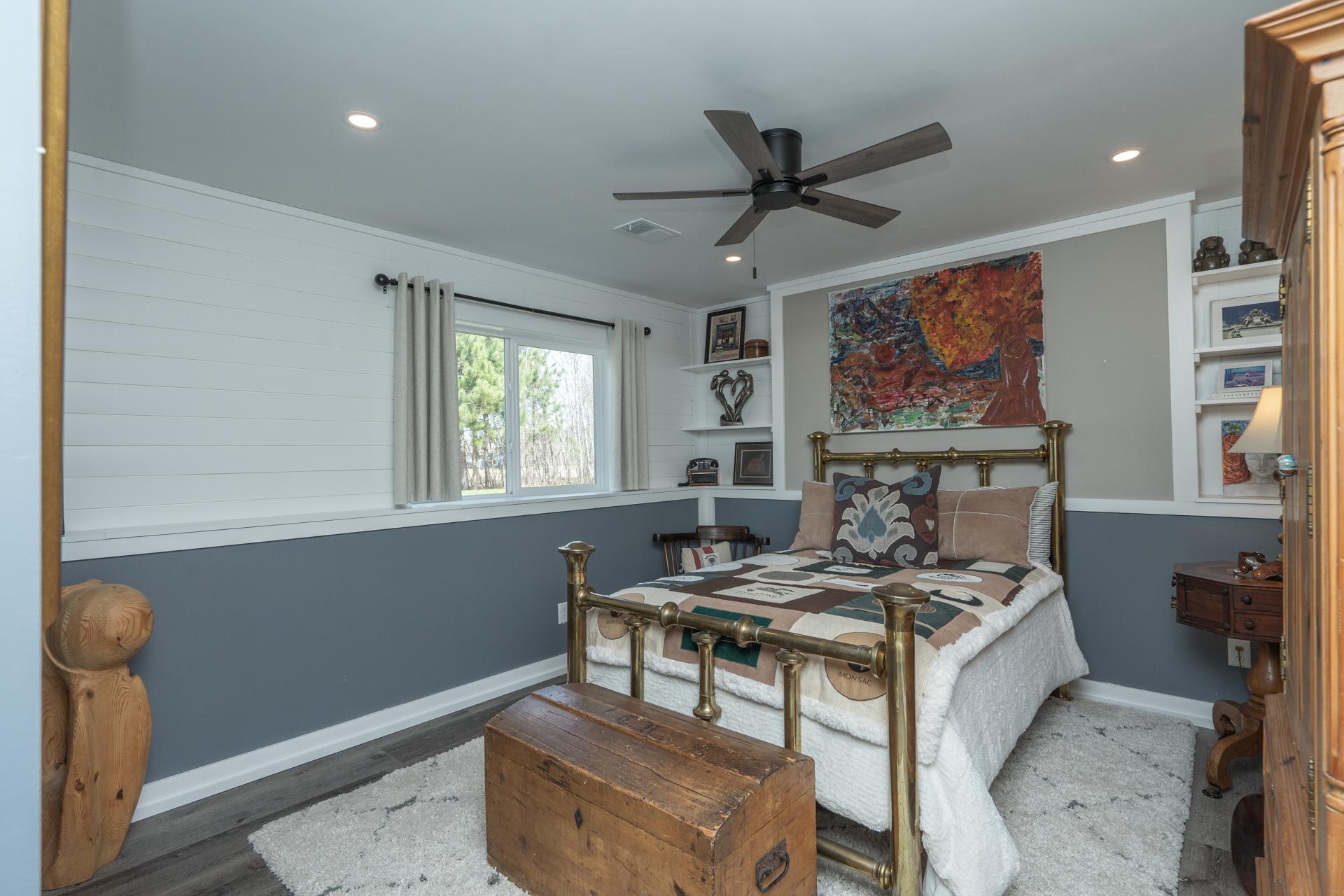 Private fourth bedroom on the lower level—great for guests or added privacy.