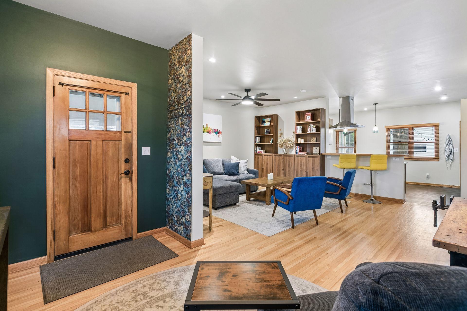 Bright, welcoming view into the living room and kitchen
